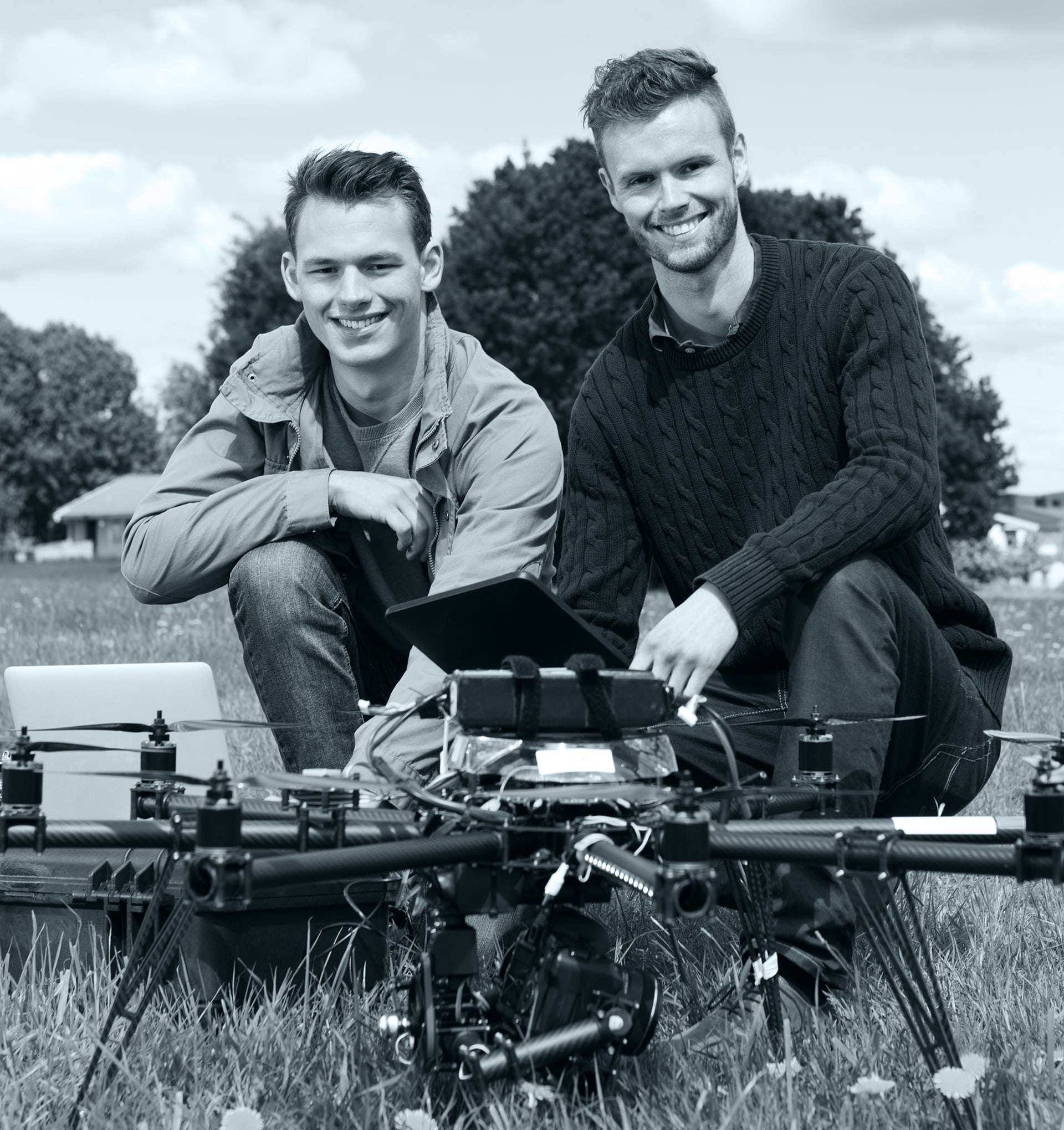 Drone photography team preparing professional aerial equipment